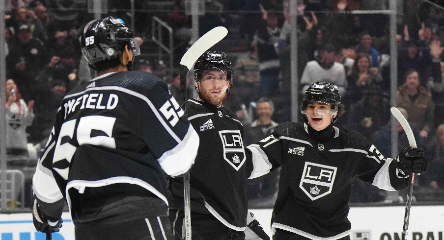 LA Kings center Pierre-Luc Dubois (80) celebrates after scoring a goal with right wing Quinton Byfield (55) and center Alex Turcotte (38) as Columbus Blue Jackets goaltender Elvis Merzlikins (90) reacts in the second period at Crypto.com Arena.