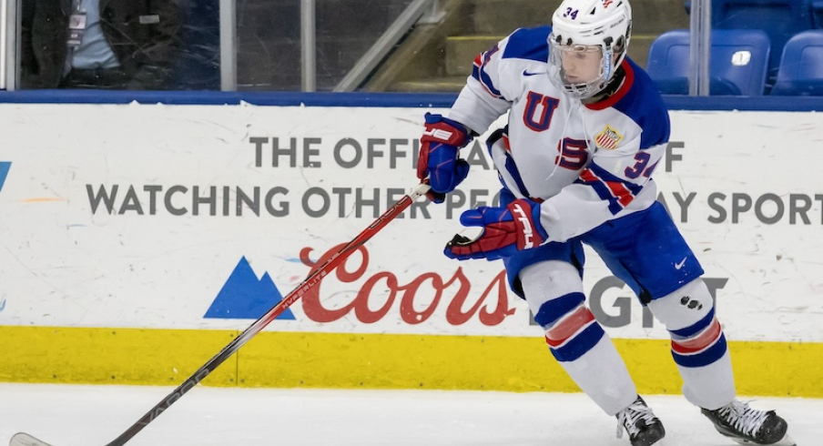 USA's Cole Eiserman (34) controls the puck against Finland during the third period of the 2024 U18 s Five Nations Tournament at USA Hockey Arena.