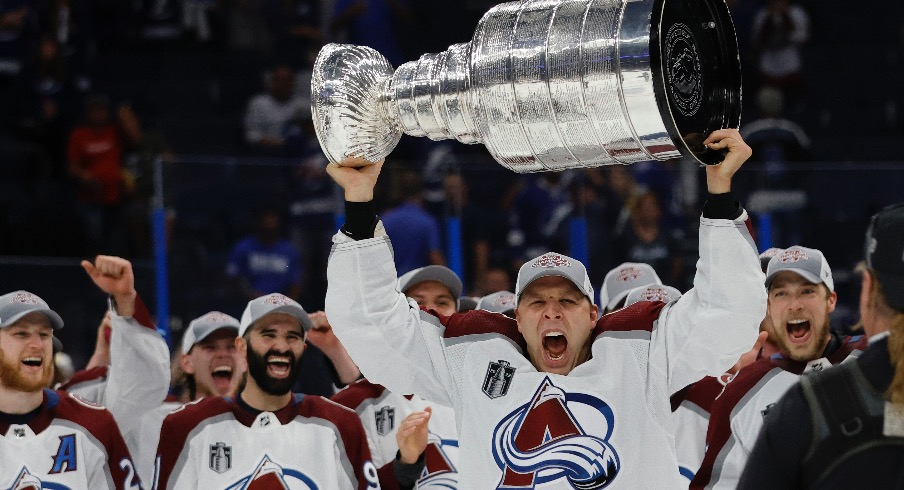 Colorado Avalanche defenseman Jack Johnson (3) celebrates with the Stanley Cup after the Avalanche game against the Tampa Bay Lightning in game six of the 2022 Stanley Cup Final at Amalie Arena.