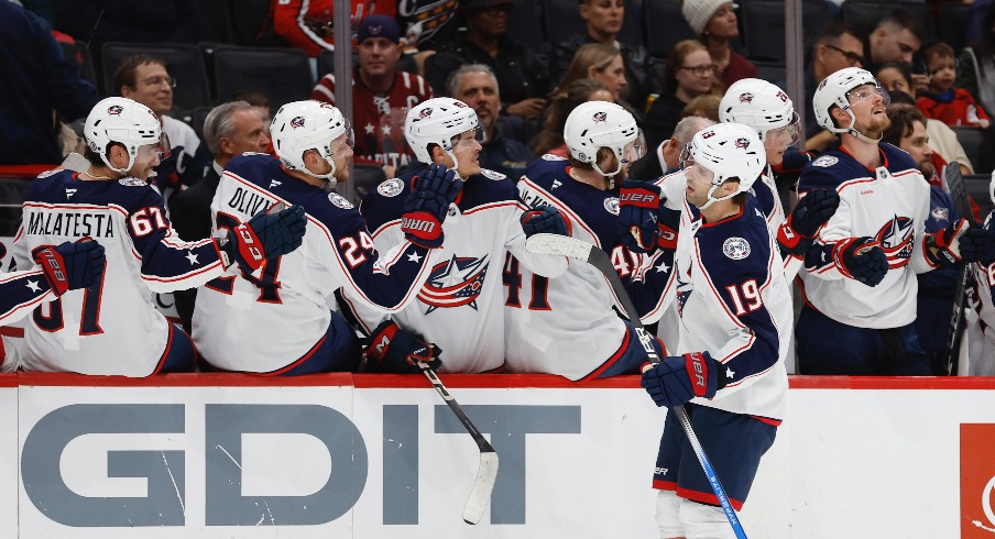 Columbus Blue Jackets center Adam Fantilli (19) celebrates with teammates after scoring a goal against the Washington Capitals in the first period at Capital One Arena.