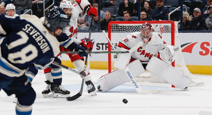 Feb 29, 2024; Columbus, Ohio, USA; Carolina Hurricanes goalie Spencer Martin (41) awaits the shot attempt from Columbus Blue Jackets defenseman Damon Severson (78) during the first period at Nationwide Arena.