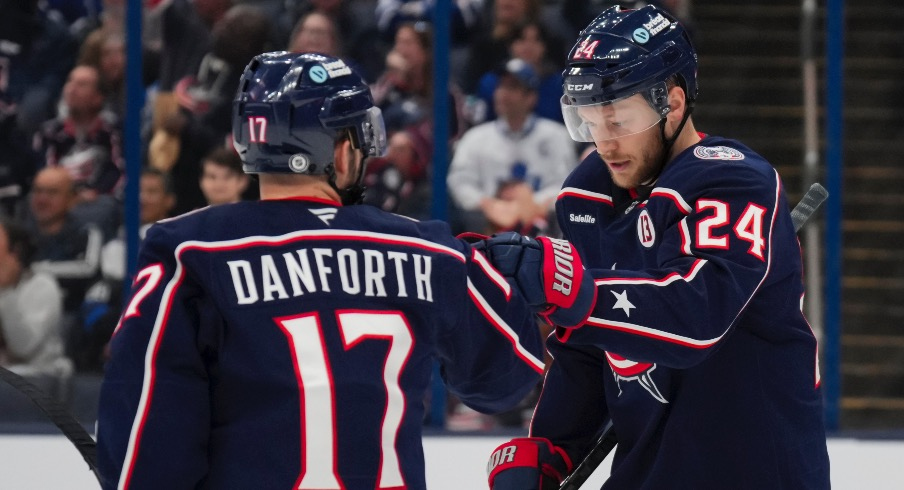 Columbus Blue Jackets right wing Mathieu Olivier (24) celebrates with teammates after scoring a goal against the Toronto Maple Leafs during the second period at Nationwide Arena.