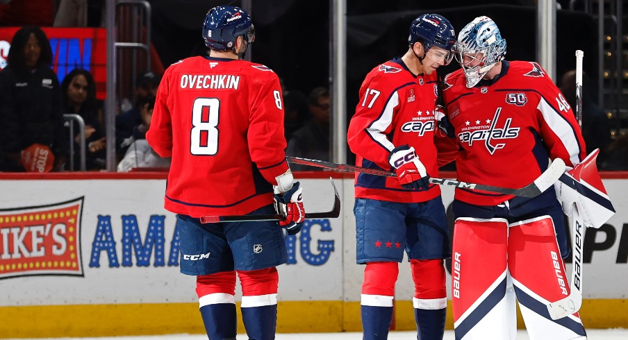 Washington Capitals goaltender Logan Thompson (48) celebrates with Capitals center Dylan Strome (17) and Capitals left wing Alex Ovechkin (8) after their game against the Columbus Blue Jackets at Capital One Arena.