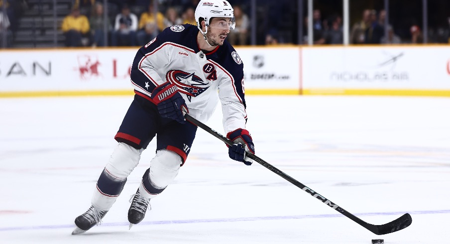 Columbus Blue Jackets defenseman Zach Werenski (8) brings the puck over the blue line in overtime against the Nashville Predators at Bridgestone Arena.