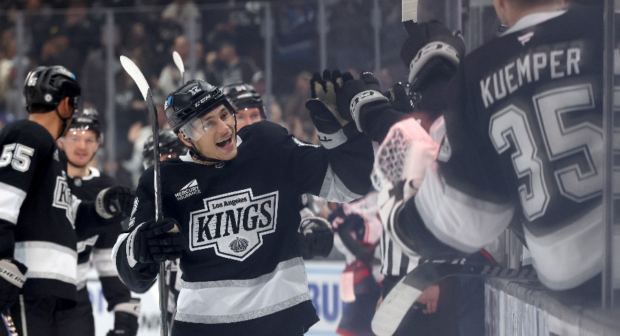 Los Angeles Kings left wing Trevor Moore (12) celebrates with teammates after scoring during the third period against the Columbus Blue Jackets at Crypto.com Arena.