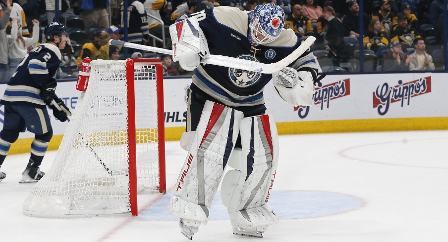 Columbus Blue Jackets goalie Elvis Merzlikins (90) celebrates the win over Pittsburgh Penguins at the end of the third period at Nationwide Arena.