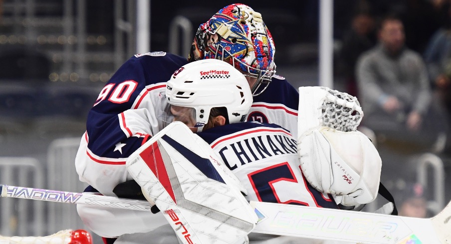 Columbus Blue Jackets goaltender Elvis Merzlikins (90) celebrates with defenseman David Jiricek (55) after defeating the Boston Bruins at TD Garden.