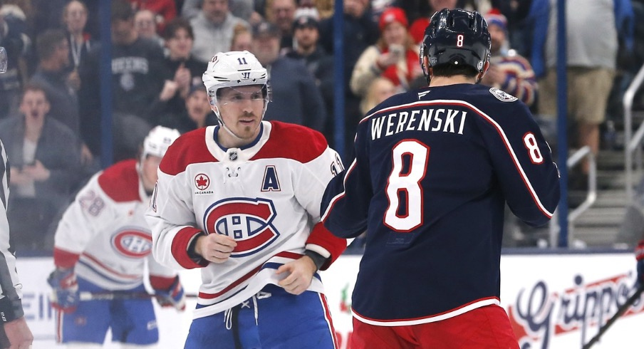 Columbus Blue Jackets defenseman Zach Werenski (8) and Montreal Canadiens right wing Brendan Gallagher (11) fight during the second period at Nationwide Arena.