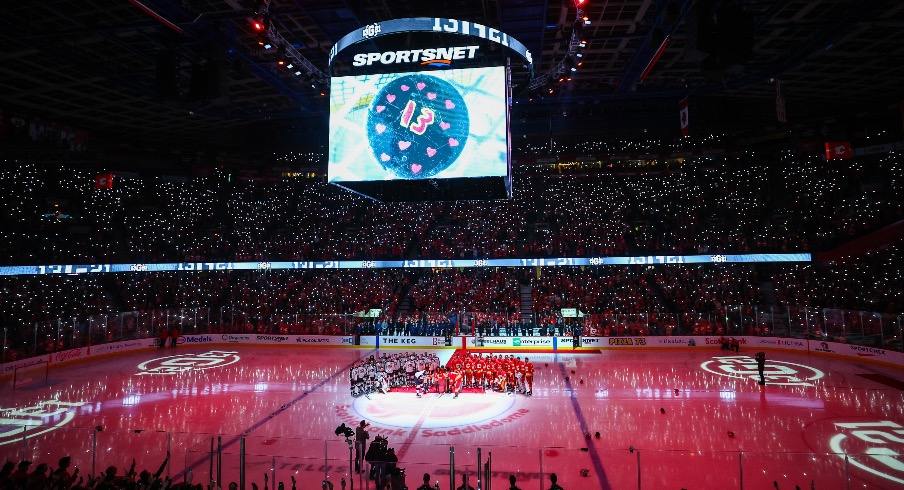 Johnny Gaudreau’s family during ceremonial puck drop by Columbus Blue Jackets center Sean Monahan (23) and Calgary Flames center Mikael Backlund (11) during the first period at Scotiabank Saddledome.