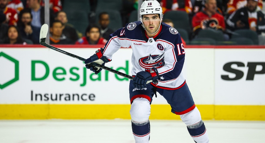 Columbus Blue Jackets defenseman Dante Fabbro (15) skates against the Calgary Flames during the second period at Scotiabank Saddledome.