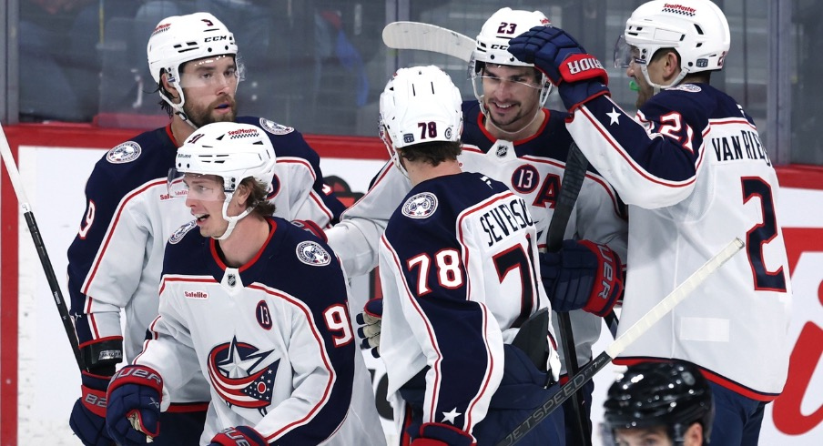 Columbus Blue Jackets center Kent Johnson (91) celebrates his third period goal against the Winnipeg Jets at Canada Life Centre.