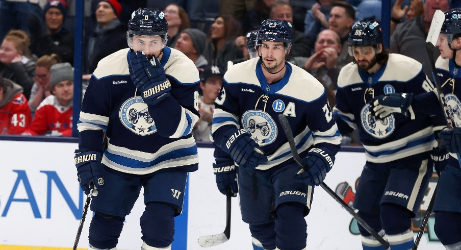 Columbus Blue Jackets defenseman Zach Werenski (8) celebrates his goal with teammates during the second period against the Washington Capitals at Nationwide Arena.