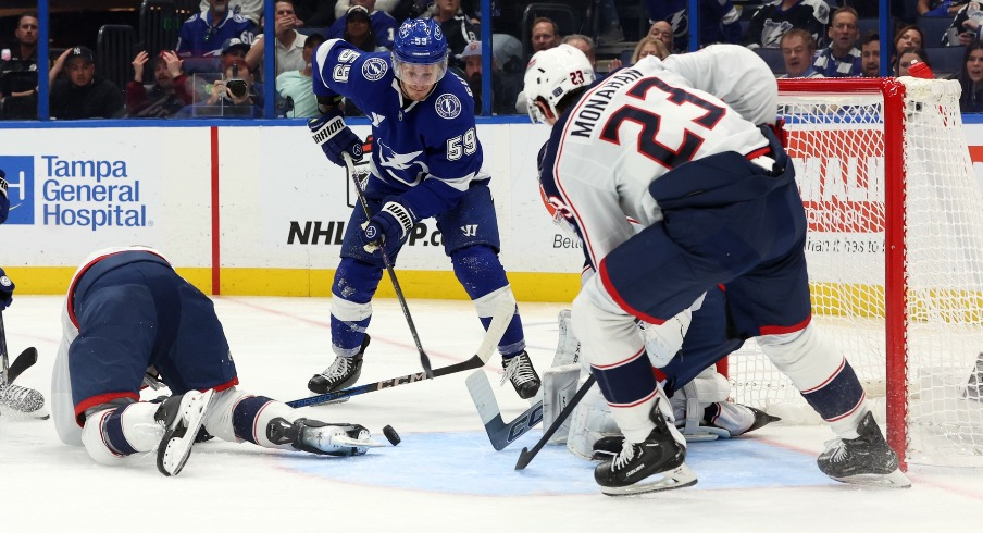 Tampa Bay Lightning center Jake Guentzel (59) shoots as Columbus Blue Jackets goaltender Jet Greaves (73) defends during the third period at Amalie Arena.