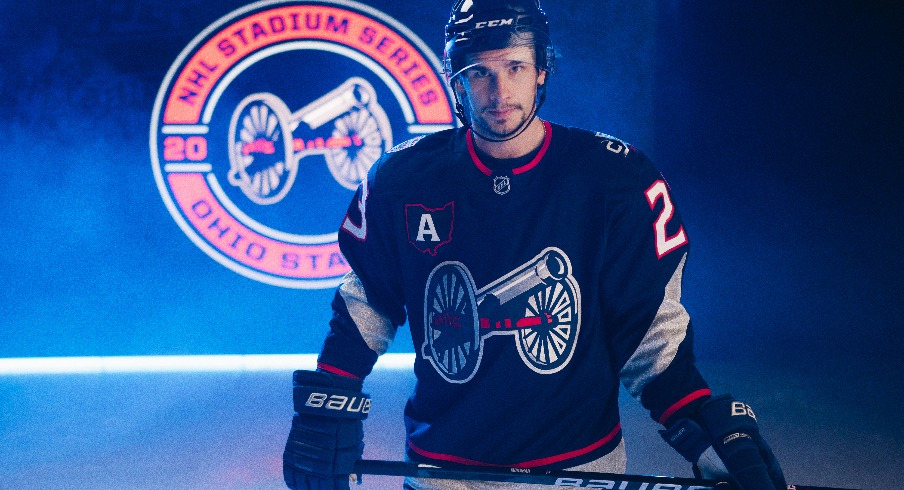 Columbus Blue Jackets center Sean Monahan sports the team's jersey for the 2025 NHL Stadium Series at Ohio Stadium.