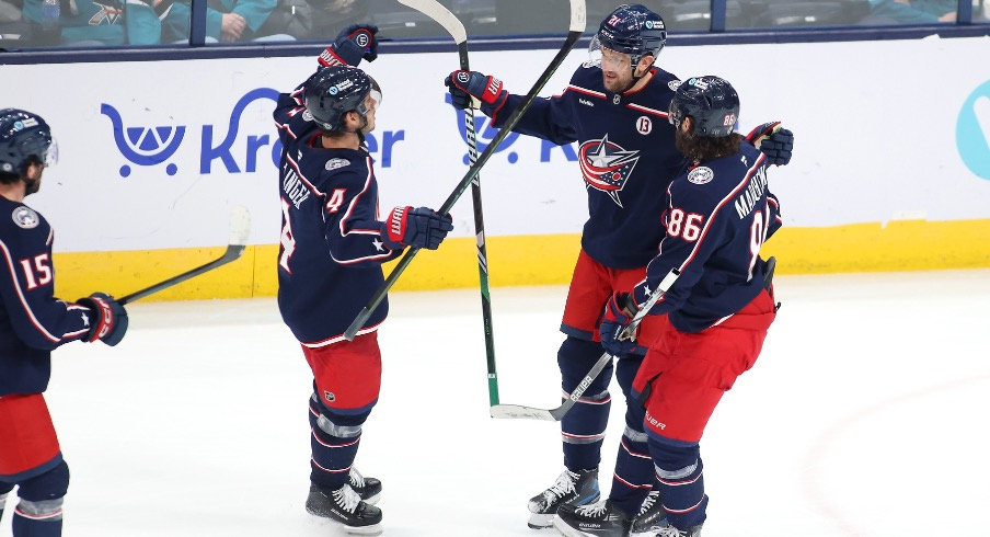 Columbus Blue Jackets left wing James van Riemsdyk (21) celebrates his goal with center Cole Sillinger (4) and right wing Kirill Marchenko (86) during the third period against the San Jose Sharks at Nationwide Arena.