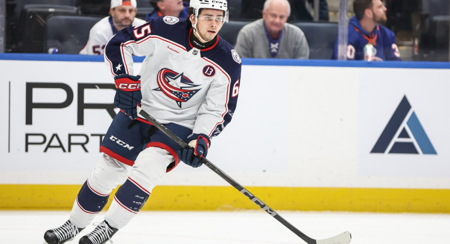 Luca Del Bel Belluz controls the puck against the New York Islanders