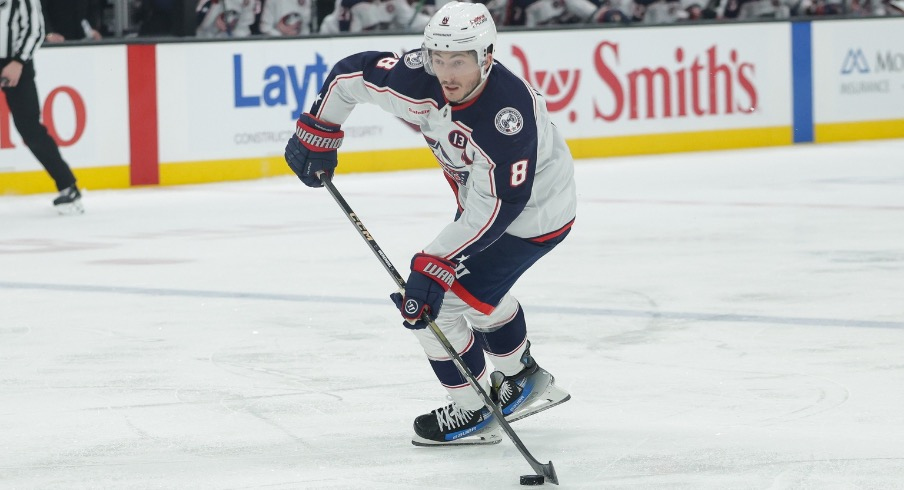 Columbus Blue Jackets defenseman Zach Werenski (8) controls the puck during the third period against the Utah Hockey Club at Delta Center.