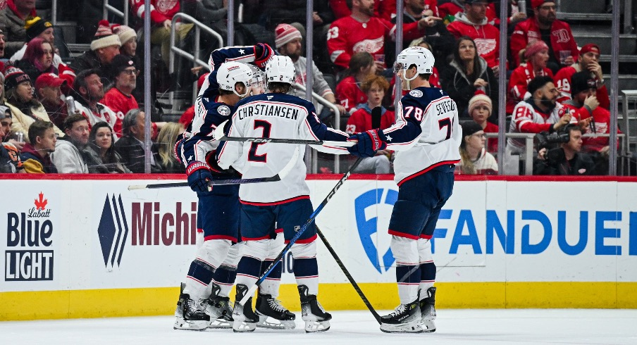 Columbus Blue Jackets center Sean Kuraly (7) celebrates his goal with teammates during the second period against the Detroit Red Wings at Little Caesars Arena.