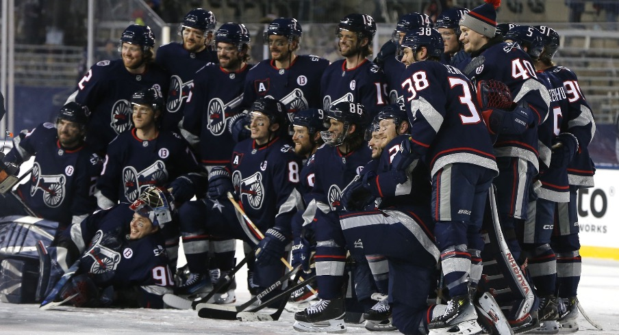 The Columbus Blue Jackets pose for a team photo after the game against the Detroit Red Wings at Ohio Stadium.