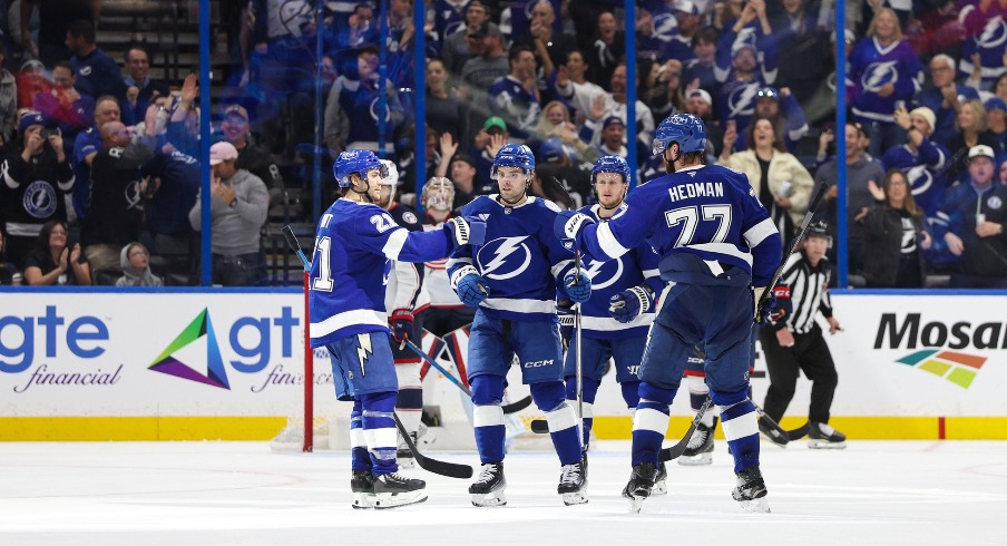 Tampa Bay Lightning defenseman Victor Hedman (77) celebrates with center Brayden Point (21) and left wing Brandon Hagel (38) after scoring a goal against the Columbus Blue Jackets in the third period at Amalie Arena.